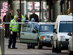 British police forensic officers investigate a vehicle which contains a suspected bomb near Piccadilly Circus in central London, Friday June 29, 2007. 