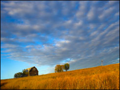 Farm building with spectacular sky during last moments of the sunset