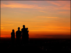 Group of people enjoying beautiful sunset from Table rock, Boise, Idaho