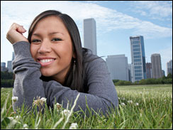 Young woman lays in the grass in Chicago's Grant Park