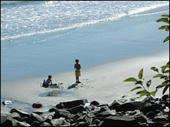 two children playing in the sand on the coast of New Hampshire