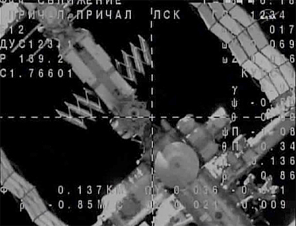 Russian Soyuz docks with space station, boosts crew back to six